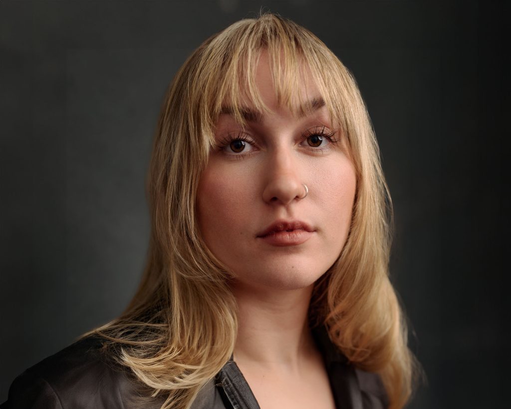 Close-up of Lily Merchant in leather jacket by Headshot Photographer Jacqui McSweeney © 2024
